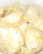 Вареники с тушеной капустой в томате